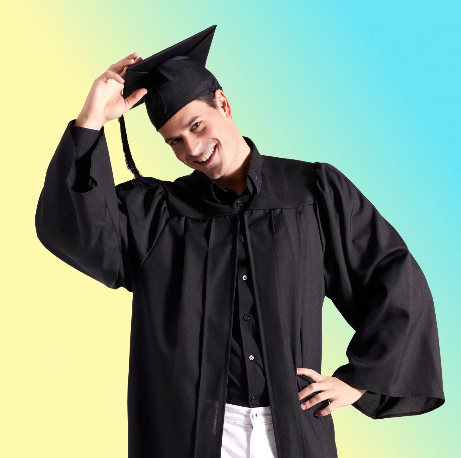 Male graduate shows the proper way to wear a regalia cap