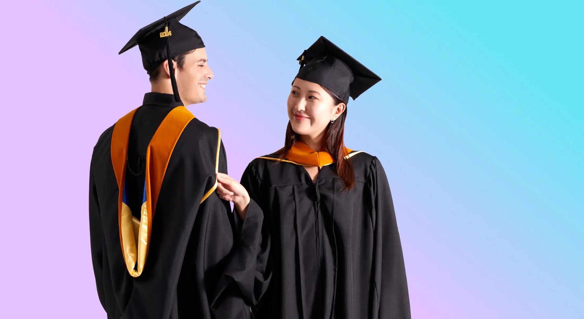 Male and female Master's graduates wearing gowns and caps celebrate.